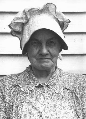 Member of the congregation of Wheeley's church who is called "Queen." She is wearing the old fashioned type of sunbonnet. Her dress and apron were made at home. Near Gordonton, North Carolina