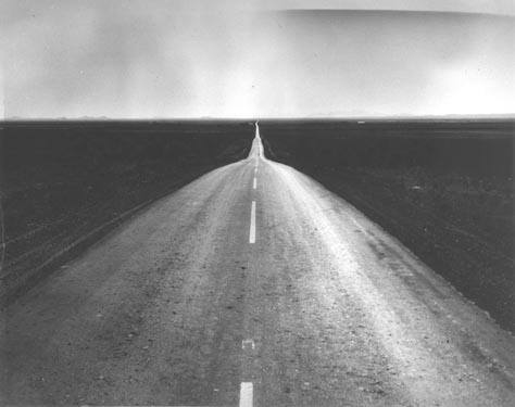 Highway to the West "They keep the road hot a goin' and a comin'." or "They've got roamin' in their head." US 54 in southern New Mexico