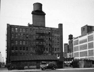 Untitled (Car, Warehouses, Edelweiss Beer sign)