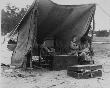 Migrant agricultural worker's family. Seven children without food. Mother aged thirty-two. Father is a native Californian. Destitute in a pea pickers camp because of the failure of the early pea crop. These people had just sold their tires in order to buy food. Most of the 2,500 people in this camp were destitute. Nipomo, California