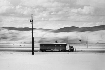 Truck in the desert near Yuma, Arizona, from the portfolio "Danny Lyon"