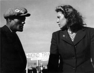 Argument in a Trailer Camp, Richmond, California. Young war workers, transplanted and in a strange town, angered and miserable