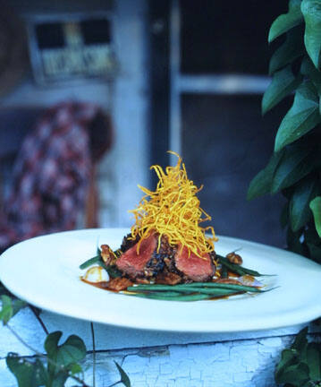 Barbequed Boneless Rack of Lamb in a Pecan Crust on an Abandoned House Porch