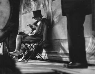 Carnival, Paris (woman reading behind stage)