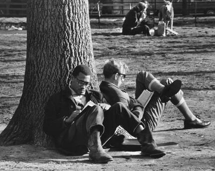 Washington Square, New York (two men reading against a tree trunk)