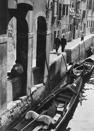 Venice (young man reading on canal side)