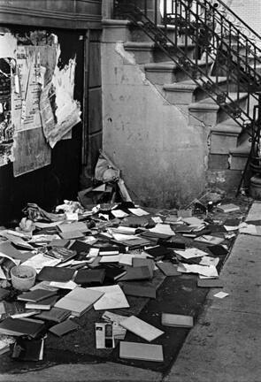 Untitled (books scattered on sidewalk)