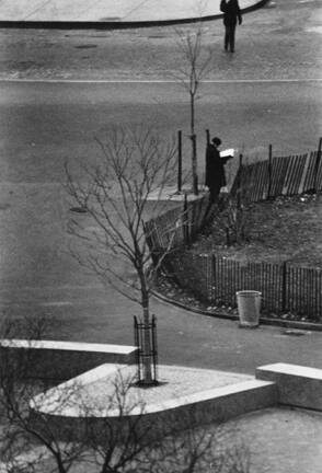 Washington Square, New York (man reading, another standing)