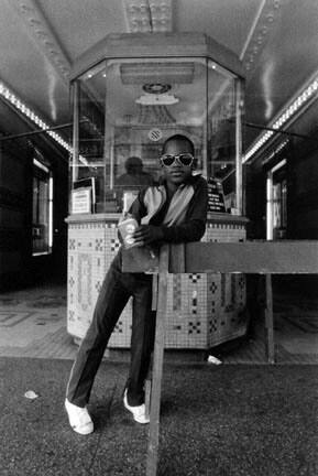 A Boy In Front of the Loews 125th Street Movie Theater, from the "Harlem, USA" portfolio