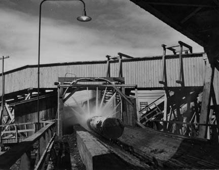 Washing logs before sawing. Longview, Washington