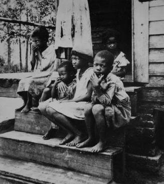 Children of turpentine worker near Cordele, Alabama. The father earns one dollar a day