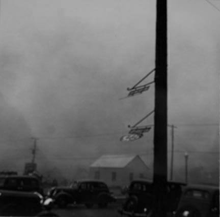 Dust storm. Note heavy metal signs blown out by wind. Amarillo, Texas