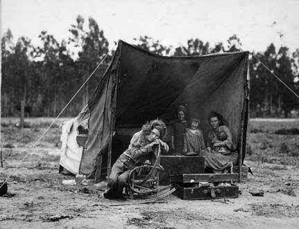 Migrant agricultural worker's family. Seven hungry children. Mother aged 32, the father is a native Californian. Destitute in a pea pickers camp because of the failure of the early pea crop. These people had just sold their tent in order to buy food. Most of the 2,500 people in this camp were destitute. Nipomo, California