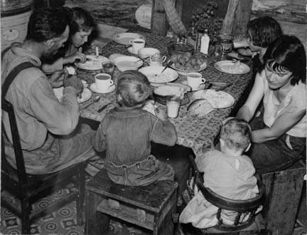 William Horavitch family eating dinner. Williams County, North Dakota.