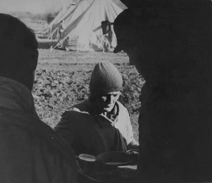 An old lady at mealtime in the camp for white refugees from the flood of 1937, Forrest City, Arkansas