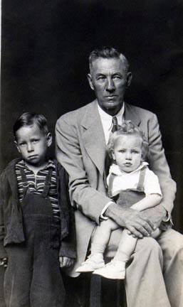 Untitled (seated man in suit with boy and girl)