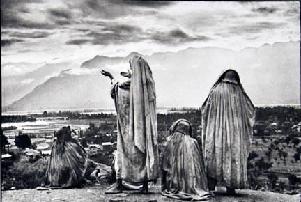 Srinagar, Kashmir, Muslim women on the slopes of Hari Parbal Hill, praying toward the sun rising behind the Himalayas, from the "Magnum Founders: In Celebration of 60 Years" portfolio