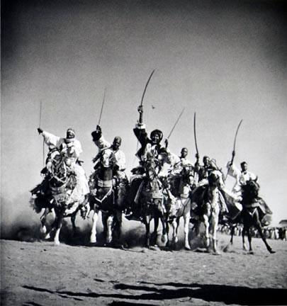 Hausa chieftains demonstrate their superb horsemanship in a "Fantasia," Chad, from the "Magnum Founders: In Celebration of 60 Years" portfolio