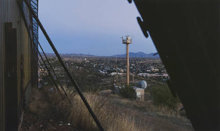 View Into Nogales from the Border Fence (with Camera Towers), Arizona, from the "Working the Line" series