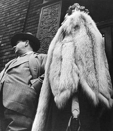 Man in Suit, Woman in Fur Coat