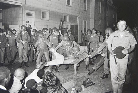 Clifford Vaughs, another SNCC photographer, is arrested by the National Guard