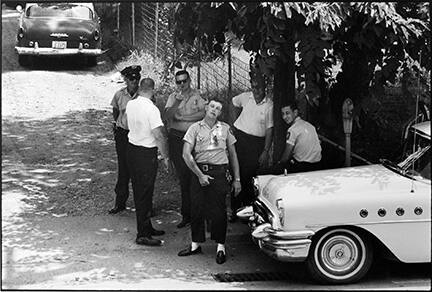 Clarksdale, Mississippi, police pose for a photograph as ministers from the National Council of Churches march to the local church