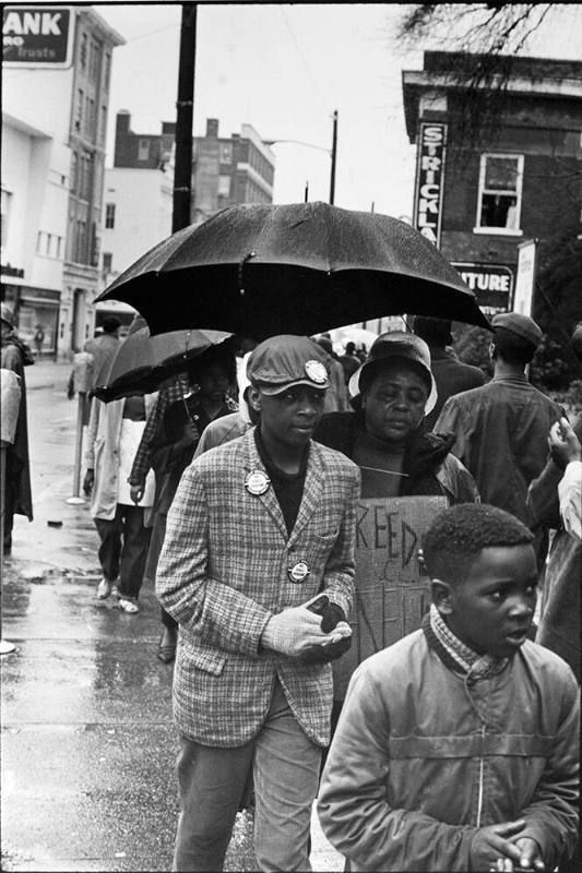 Fannie Lou Hamer, sharecropper from a family of twenty children, evicted from her home for applying to register to vote, severely beaten in the Winona police station, SNCC field secretary from Ruleville, and future Mississippi Freedom Democratic party candidate for Congress, marches in the cold Hattiesburg rain