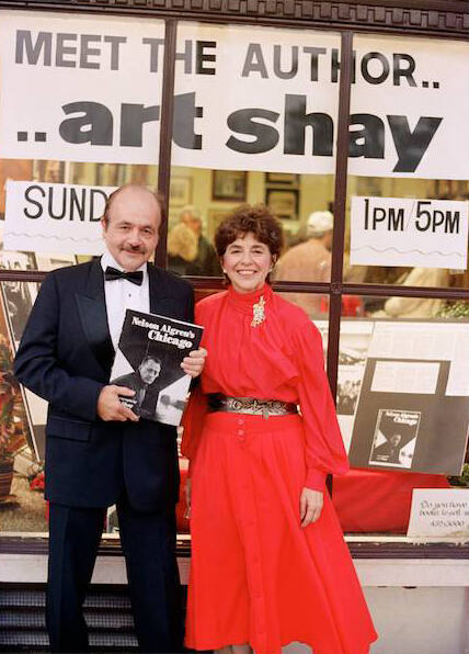 In 1988, I was the first author Florence honored with a book-signing. We sold 70 books. Our son Richard assisted making the picture, over-riding my self timer.