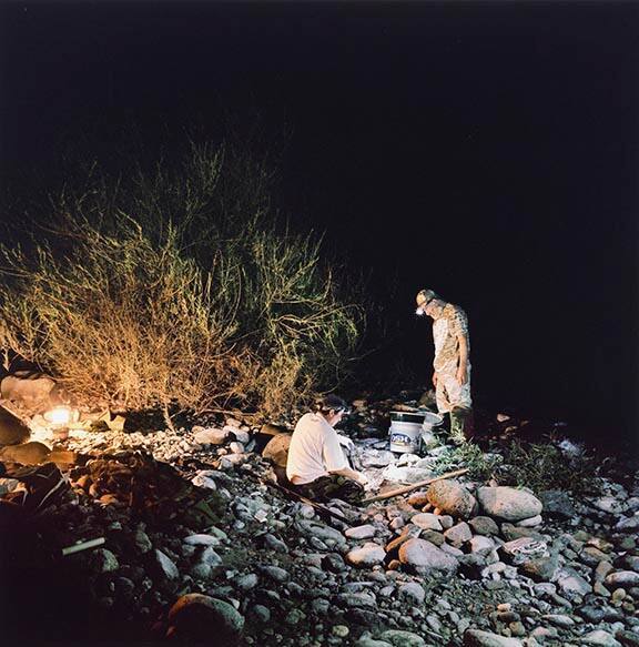 Adolf and Martin night prospecting by the Scott River, Klamath National Forest, California, from the 29 x 29 Portfolio by the graduates of the MFA Photography, Video and Related Media Program at the School of Visual Arts