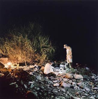 Adolf and Martin night prospecting by the Scott River, Klamath National Forest, California, from the 29 x 29 Portfolio by the graduates of the MFA Photography, Video and Related Media Program at the School of Visual Arts