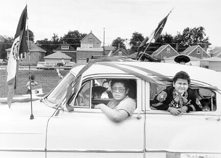 Three Young Men Pass By on a Fifties Style Car in the Annual Mexican Independence Day Parade