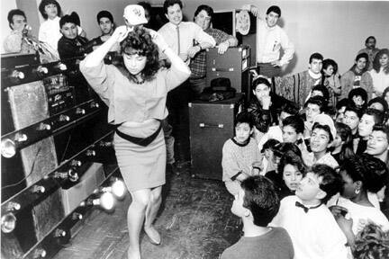 A Young Girl Dances Around on Stage for a Hot Legs Contest at the Mexican Patriotic Club, April 8, 1988