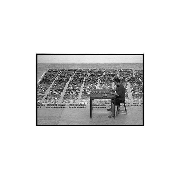 Ai Weiwei at work in his studio, Caochangdi, Beijing