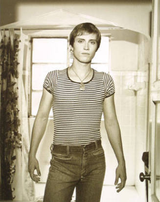 Tom, composer and pianist, in his bathroom with earring, August, 1974. Berkeley