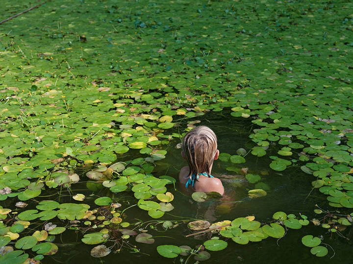 Maddie with Invasive Water Lilies, North Carolina, from the "Human Nature" series