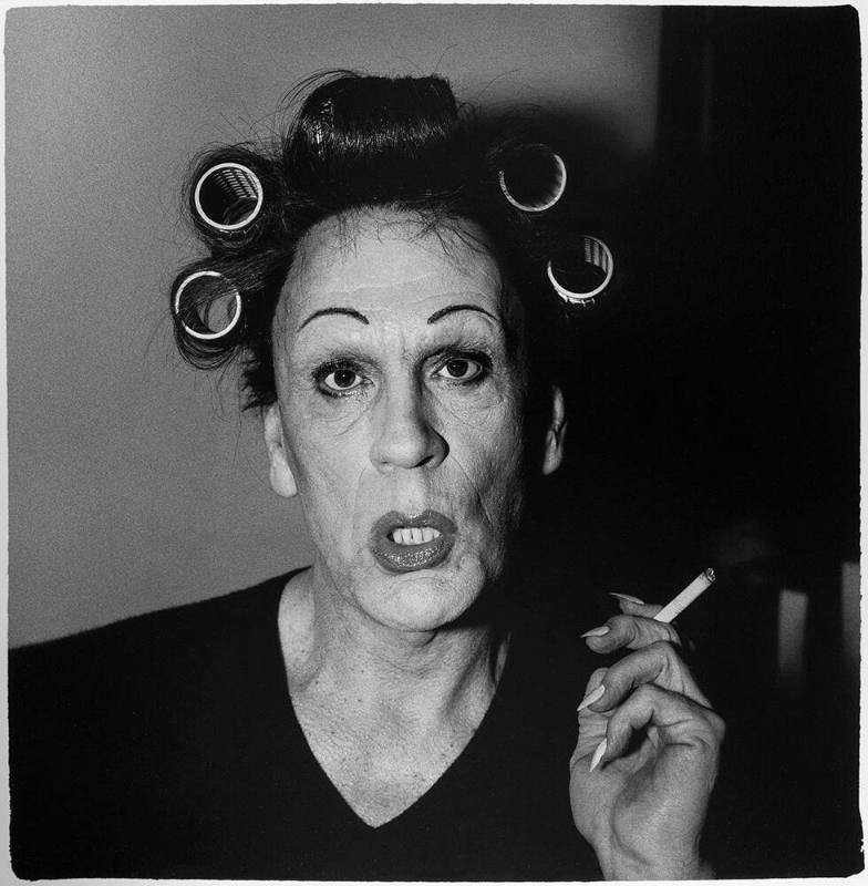 Diane Arbus / A Young man in curlers at home on West 20th Street, NYC (1966)