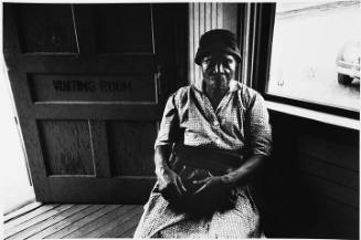 Woman sitting in waiting room, Bayou, MS.