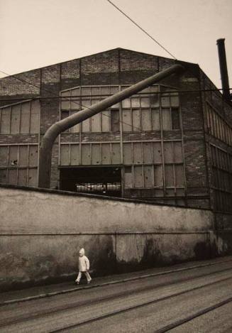 Untitled (child walking by factory wall), from the "Ostrava" series