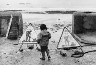 Child between construction signs, Brittany, FR