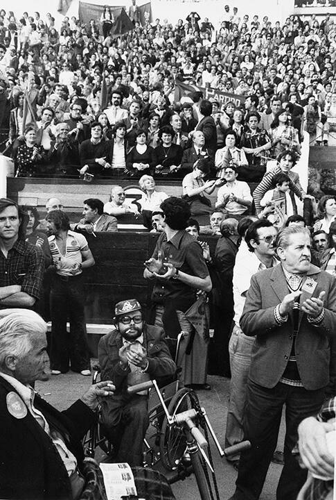 Manifestants clapping during Communist Party mass meeting in a bullring, Madrid, Spain