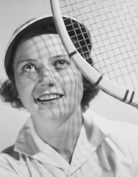 Portrait of a woman with tennis racket