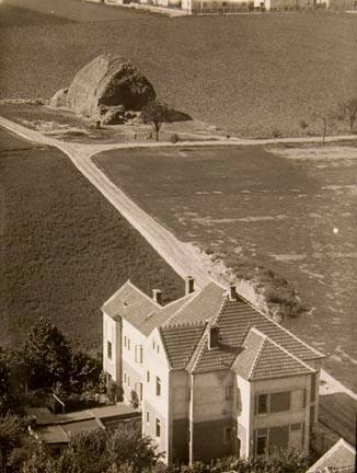 Untitled (country road, big rock, house in foreground)