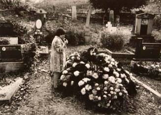 Untitled (woman smoking in cemetery), from the "Village Photo" series