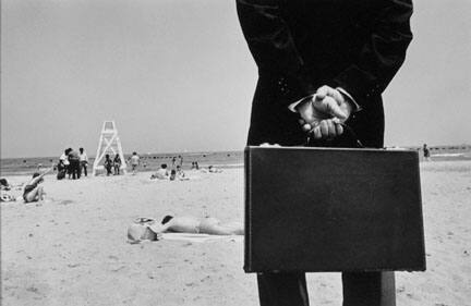 Man in Business Suit on Beach