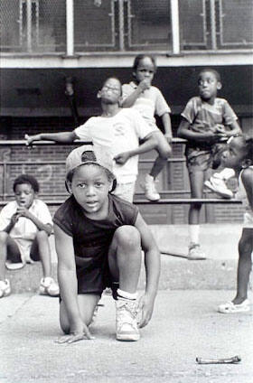 Kids playing outside, 929 N Hudson, Cabrini-Green, from Changing Chicago