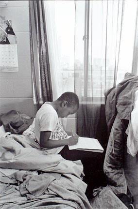 Boy doing homework, Cabrini-Green, from Changing Chicago