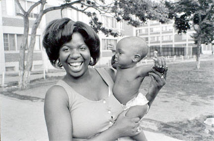 Jackie and her baby outside 929 N Hudson, Cabrini-Green, from Changing Chicago