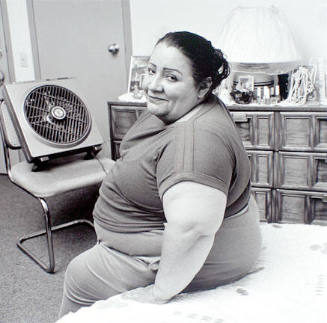 Emma in her room at the Harold Washington SRO, from Edge of Shelter Project, 1992