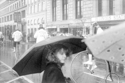 A Spectator and the Shrine Antique Bicycle Club, McDonald's Christmas Parade, Michigan Avenue and Jackson Boulevard, from Changing Chicago