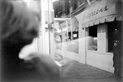 Woman's Reflection in a Bus Window, Chicago, from Changing Chicago